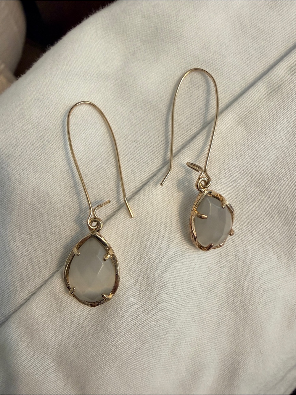 Kendra Scott Gold Teardrop Dangle Earrings with light grey stone